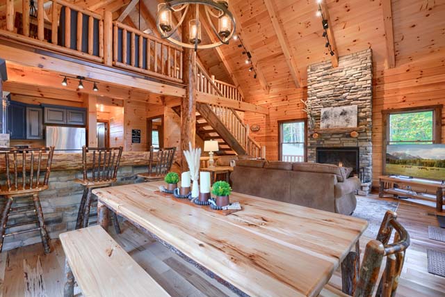 open dining area with a log table and chairs