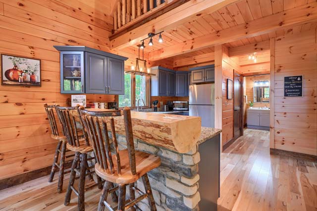 Rustic log cabin kitchen with wooden countertops