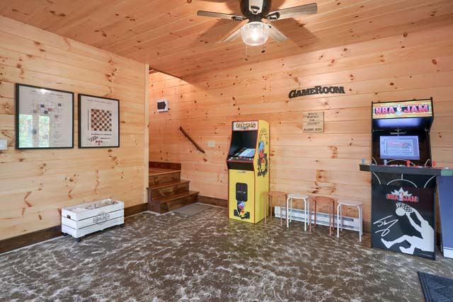 basement game room with arcade games