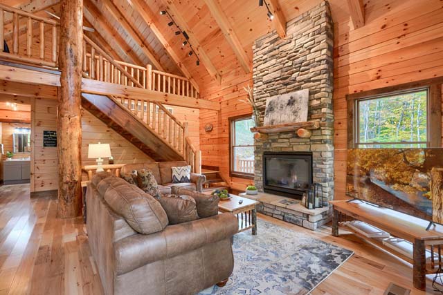 Cozy log cabin living room with fireplace