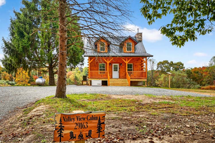 valley view cabin cozy log cabin exterior with covered porch