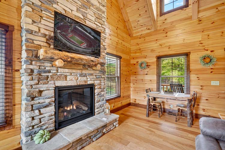 valley view cabin exterior at dusk with porch lights