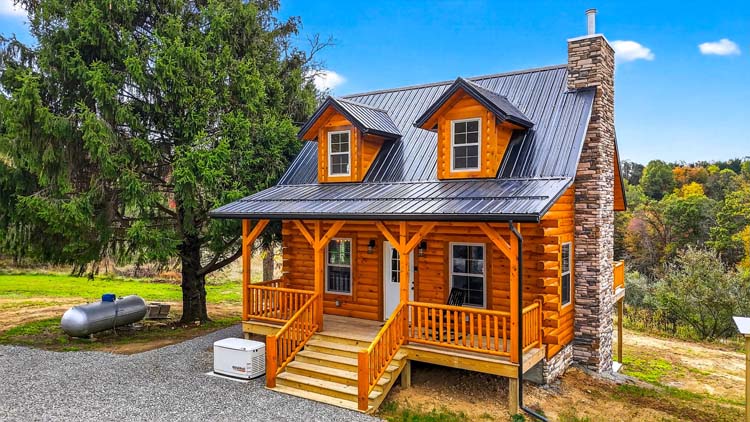 valley view cabin rear porch with seating and forest view